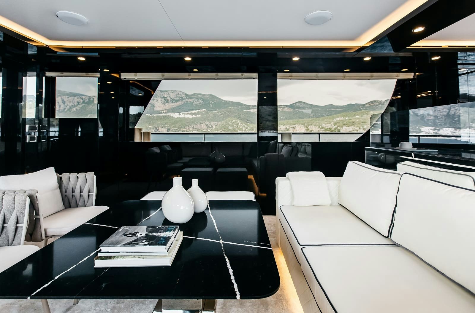 a room with a large window and a large white sofa aboard LEVANNA Yacht for Sale