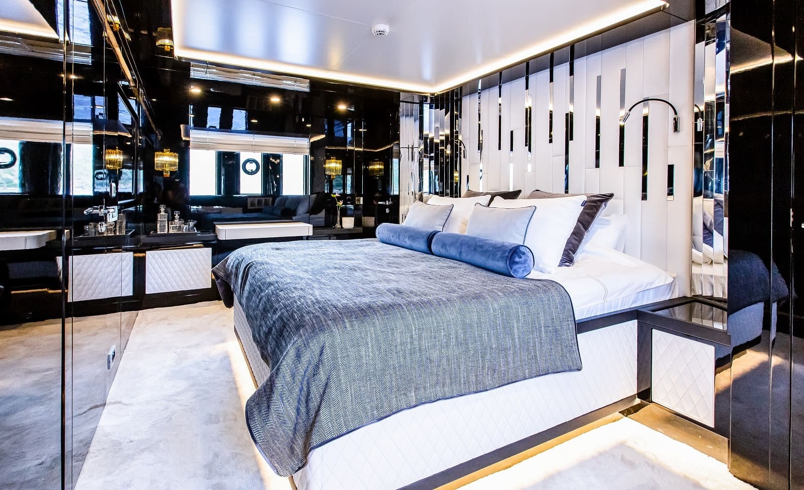 a room with a bed and a desk aboard LEVANNA Yacht for Sale