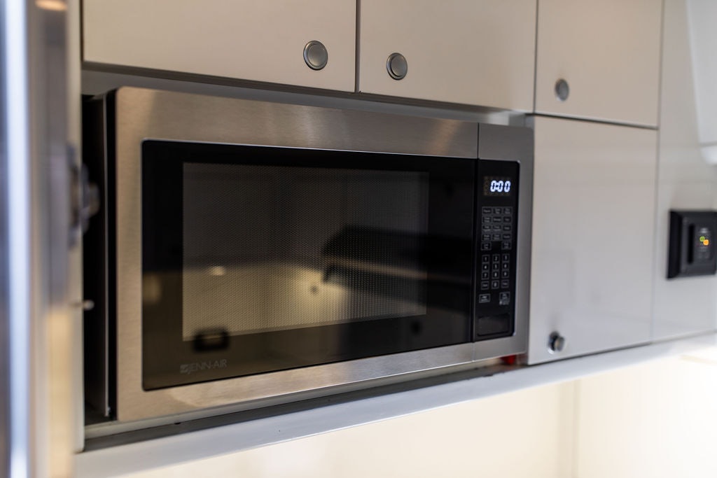 a microwave oven in a kitchen aboard CABOCHON Yacht for Sale