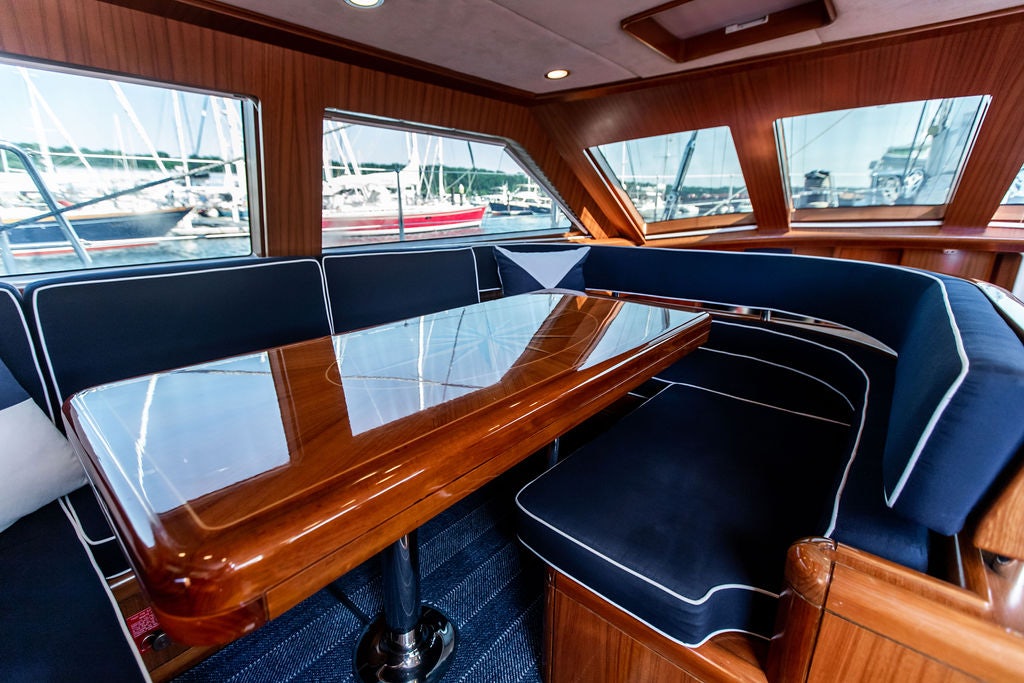 a table with chairs on it aboard CABOCHON Yacht for Sale