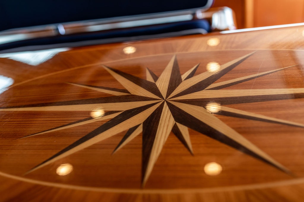 a wooden board with a design aboard CABOCHON Yacht for Sale