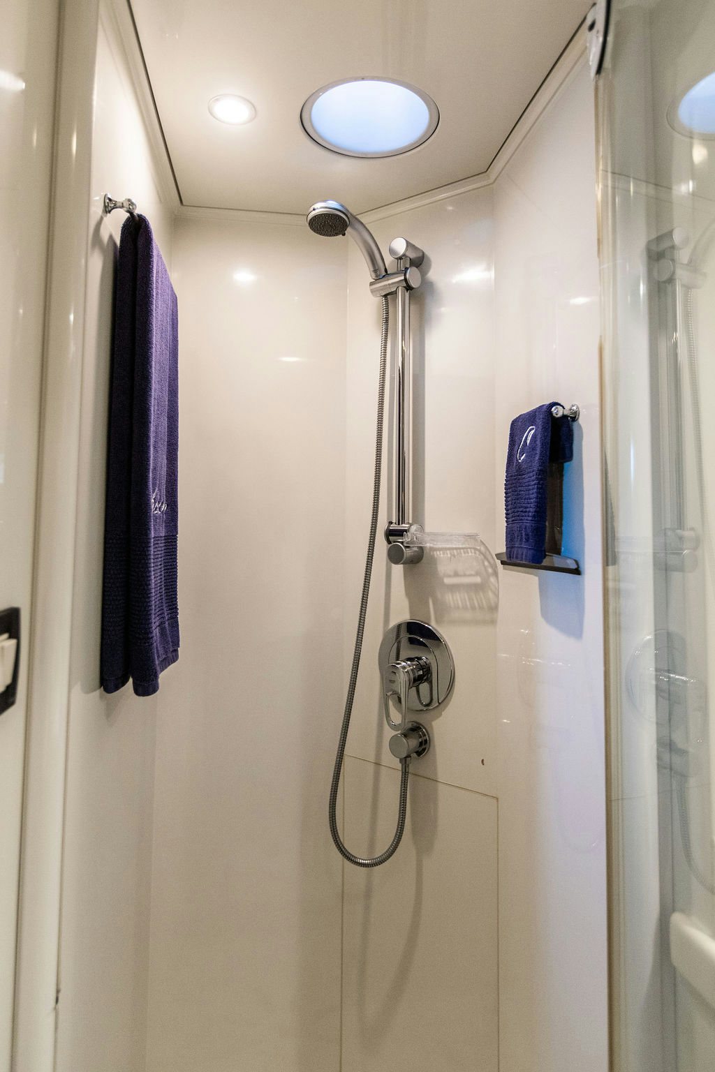 a shower with a purple towel from the wall aboard CABOCHON Yacht for Sale