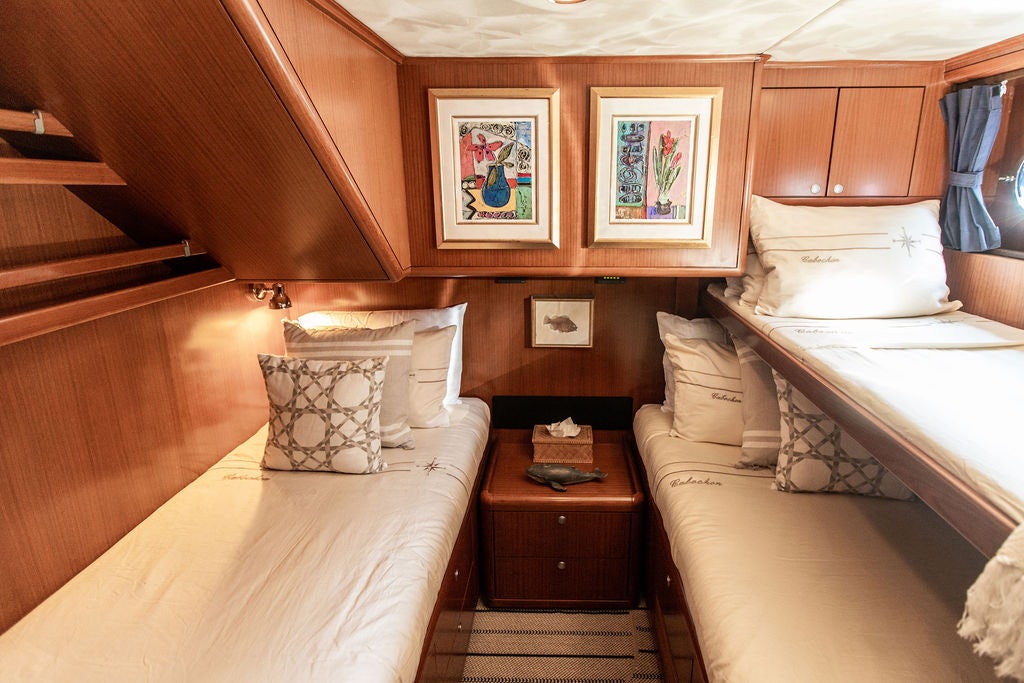 a room with two beds aboard CABOCHON Yacht for Sale