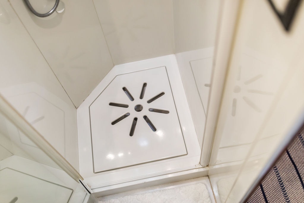 a white wall with a white fan aboard CABOCHON Yacht for Sale