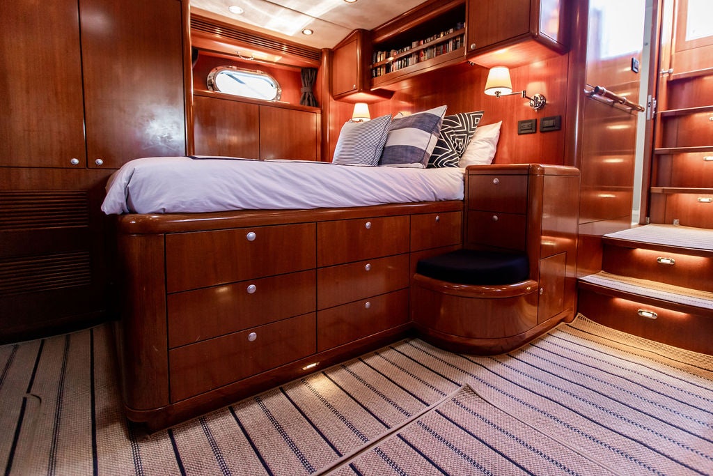 a bed in a room aboard CABOCHON Yacht for Sale