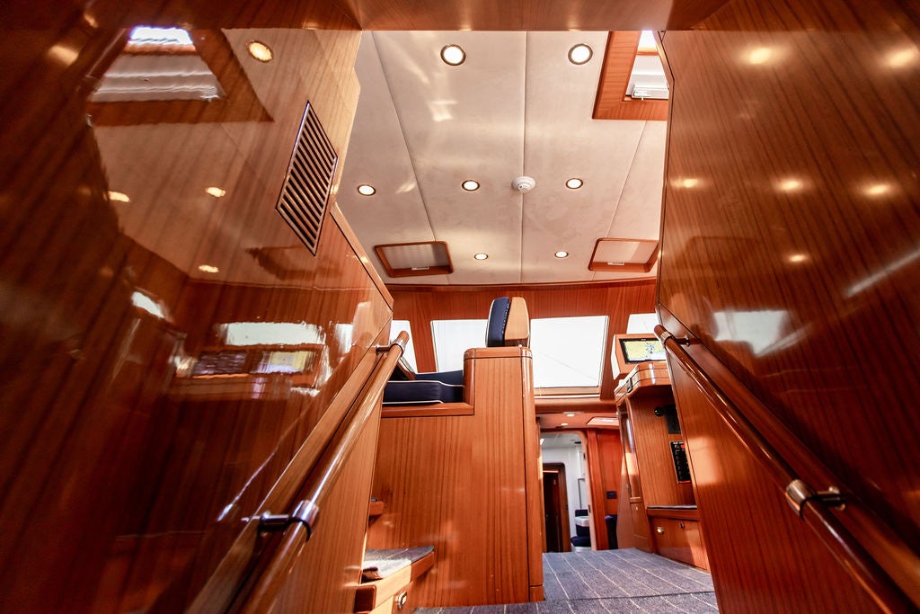 a room with wooden walls and wood floors aboard CABOCHON Yacht for Sale