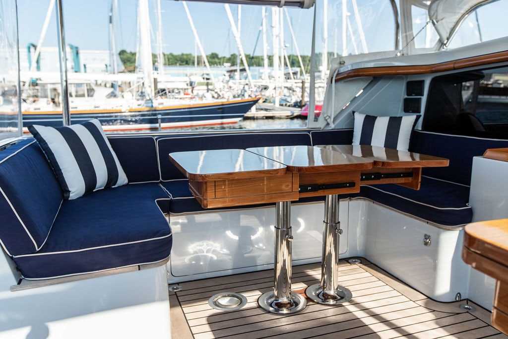 a table with chairs around it aboard CABOCHON Yacht for Sale