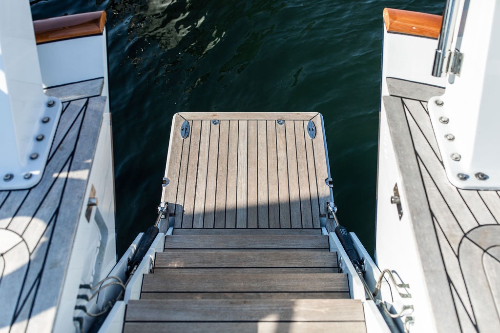 a wooden staircase in a boat aboard CABOCHON Yacht for Sale