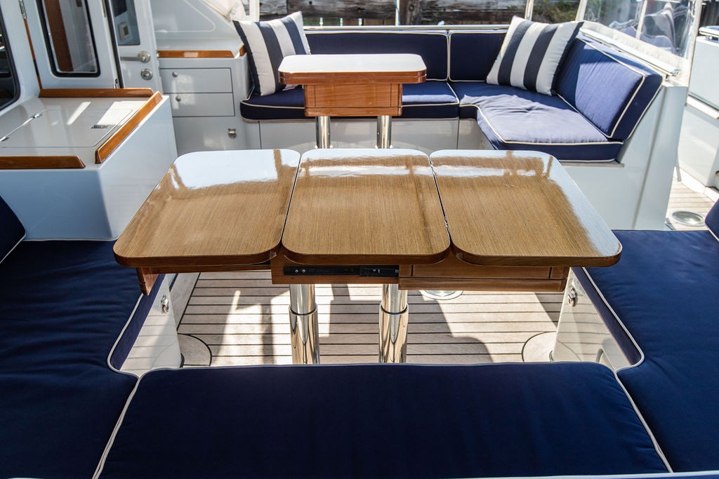 a room with a couch and a table aboard CABOCHON Yacht for Sale