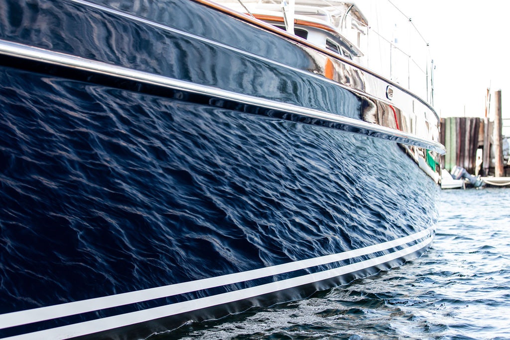 a large ship in the water aboard CABOCHON Yacht for Sale