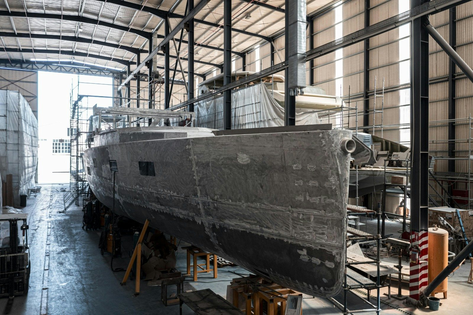 a large grey machine in a factory aboard XPM85 Yacht for Sale