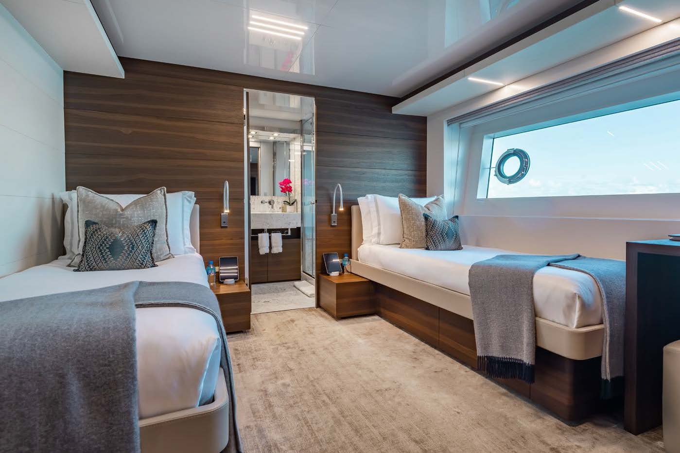 a room with a bed and a mirror aboard EROS Yacht for Charter