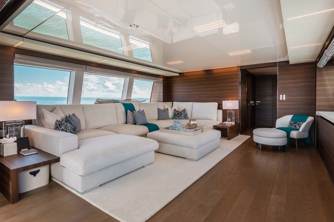 a living room with a large window aboard EROS Yacht for Charter