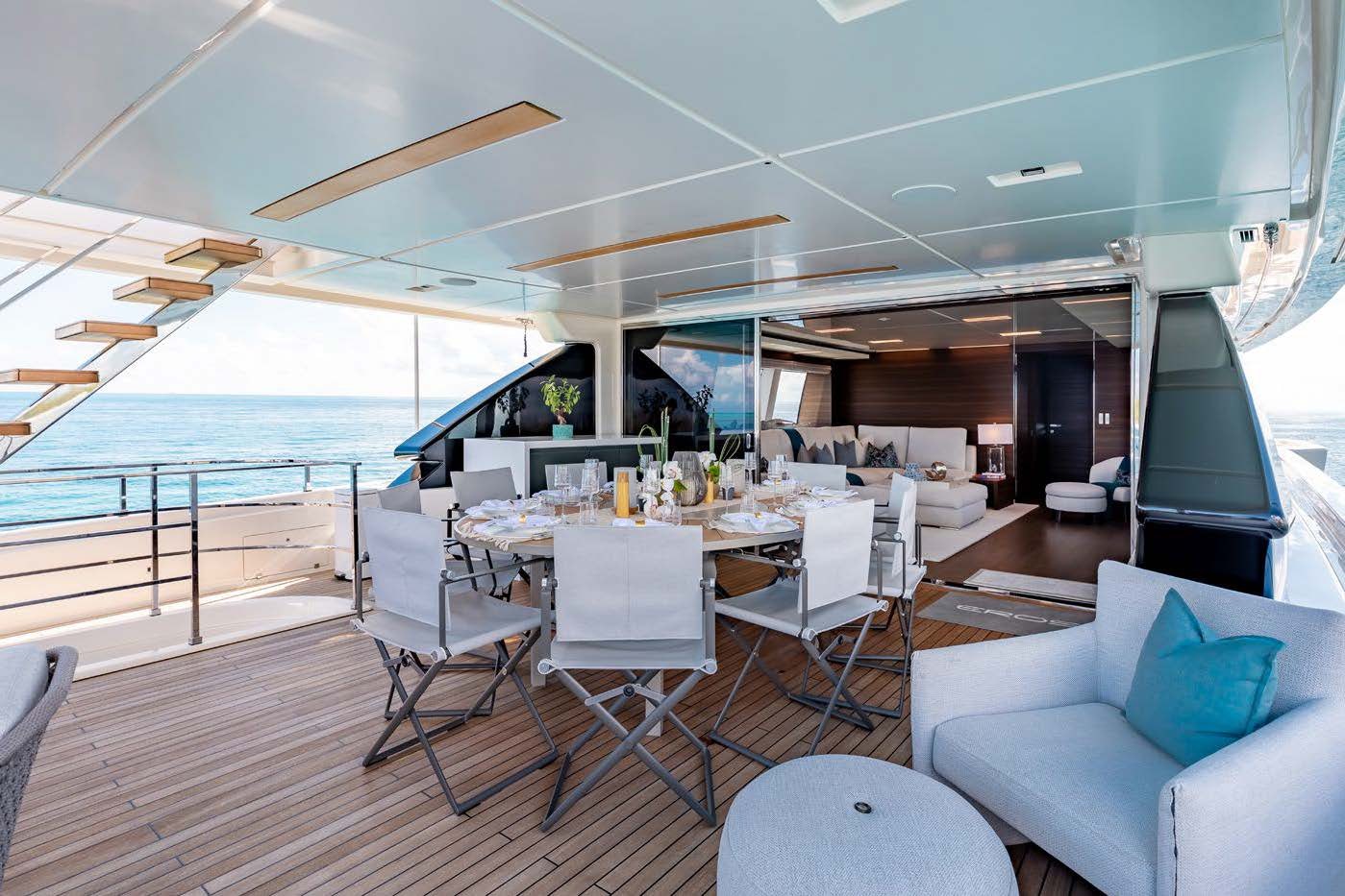 a room with a table and chairs aboard EROS Yacht for Charter