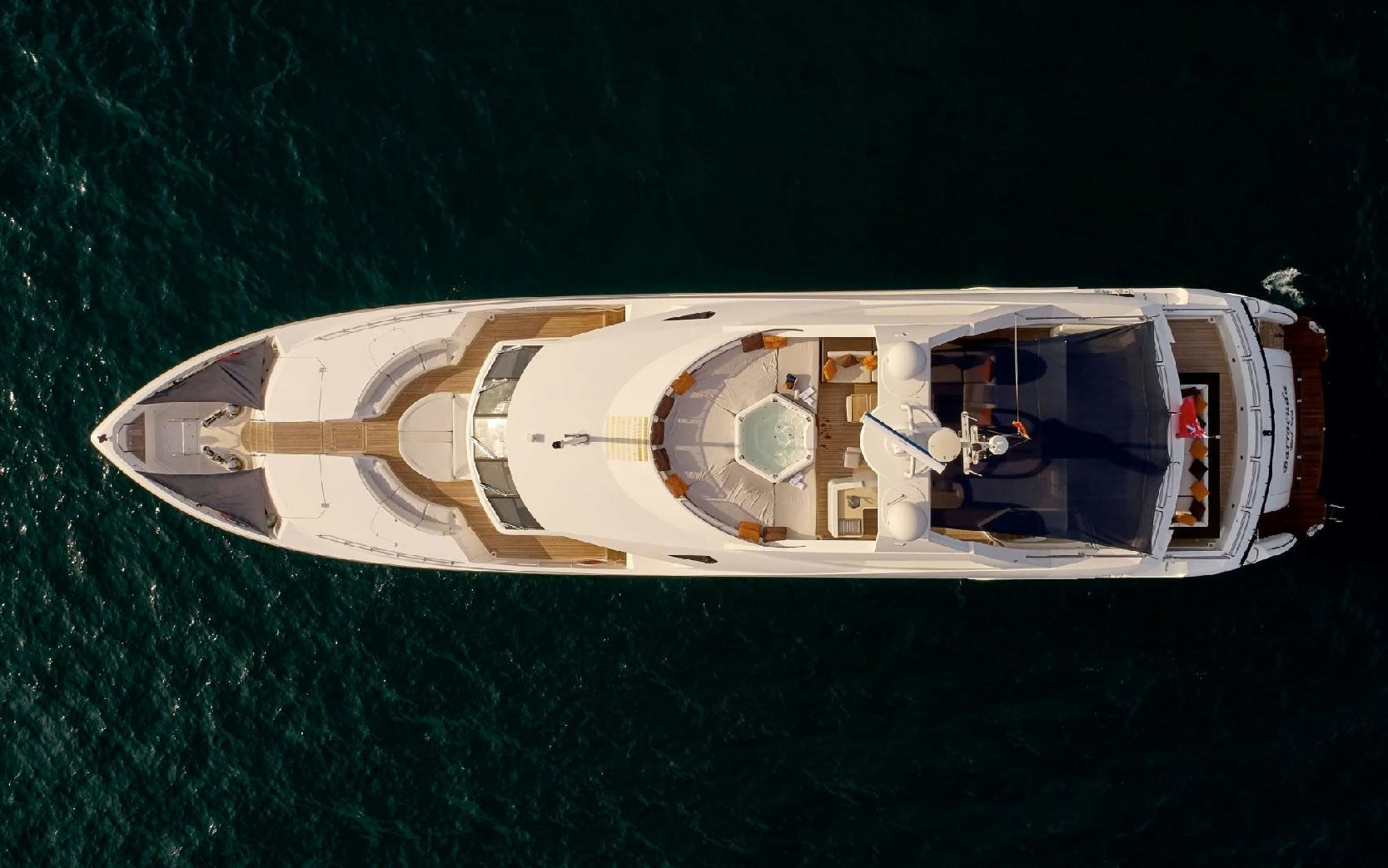 a white and gold boat on water aboard KATARIINA I Yacht for Charter