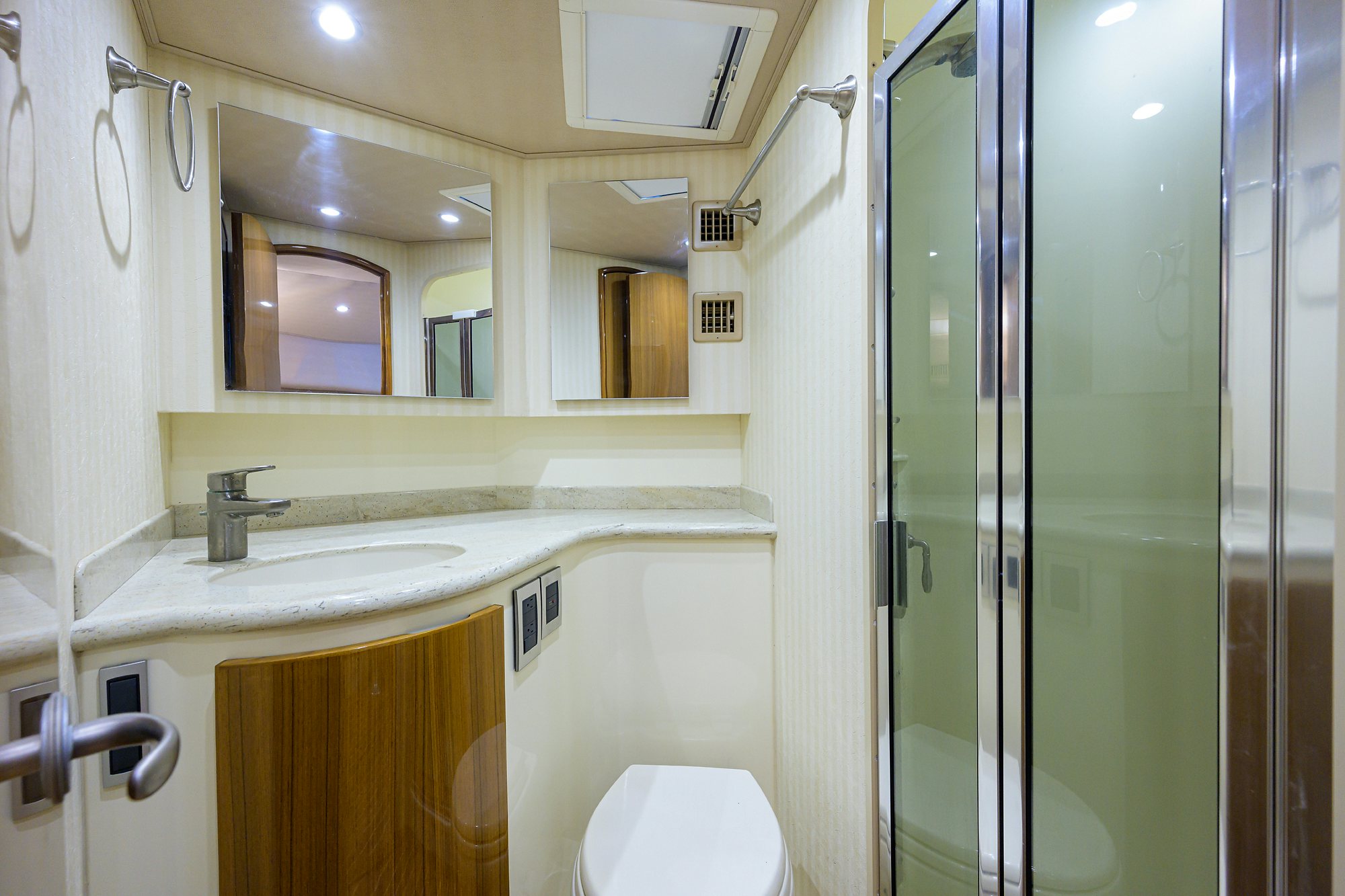 a bathroom with a glass shower aboard GALENE Yacht for Sale