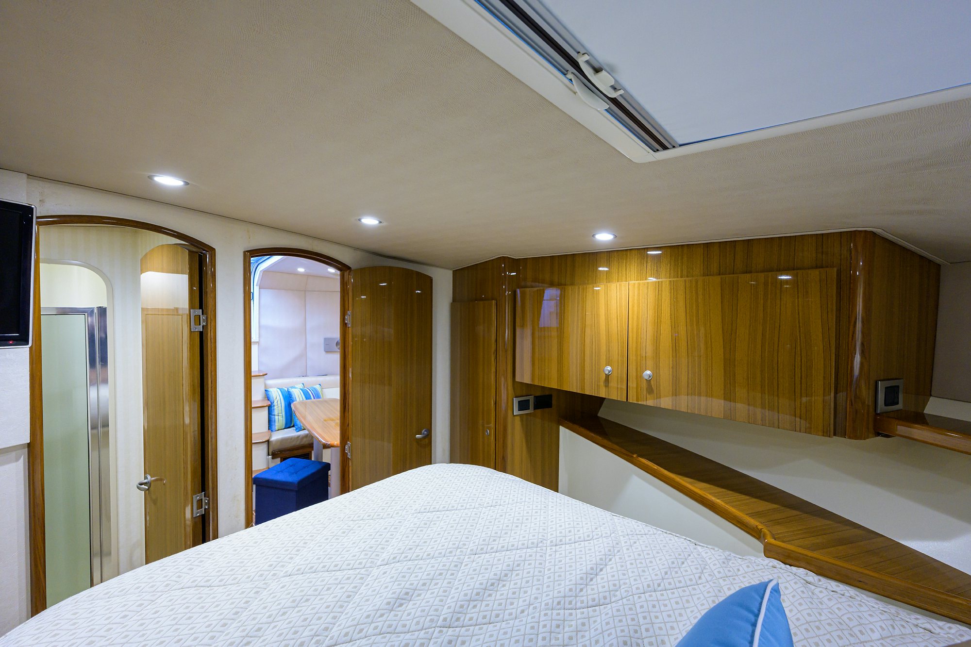 a hotel room with a bed and a mirror aboard GALENE Yacht for Sale