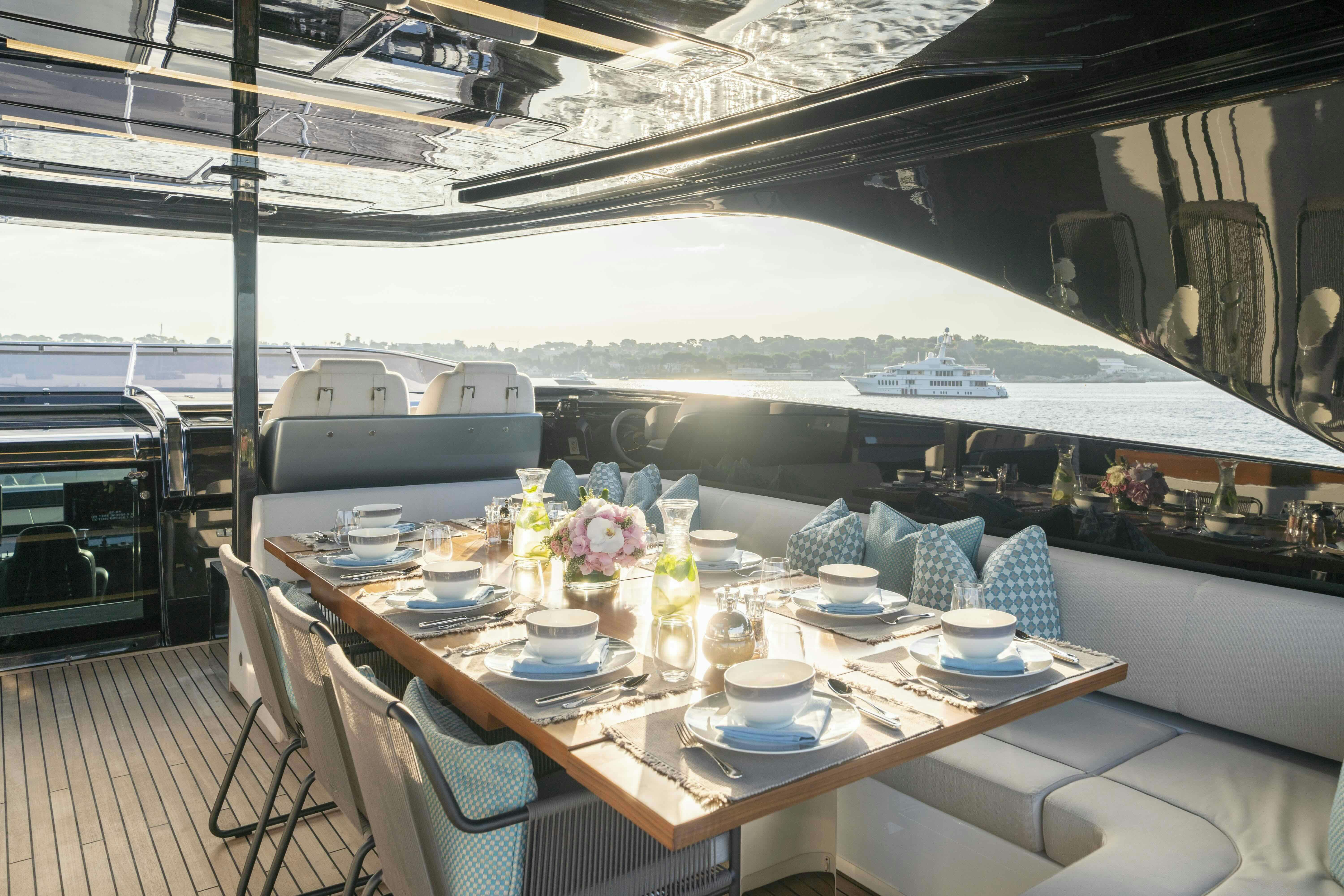 a table set for a meal aboard ELYSIUM I Yacht for Sale