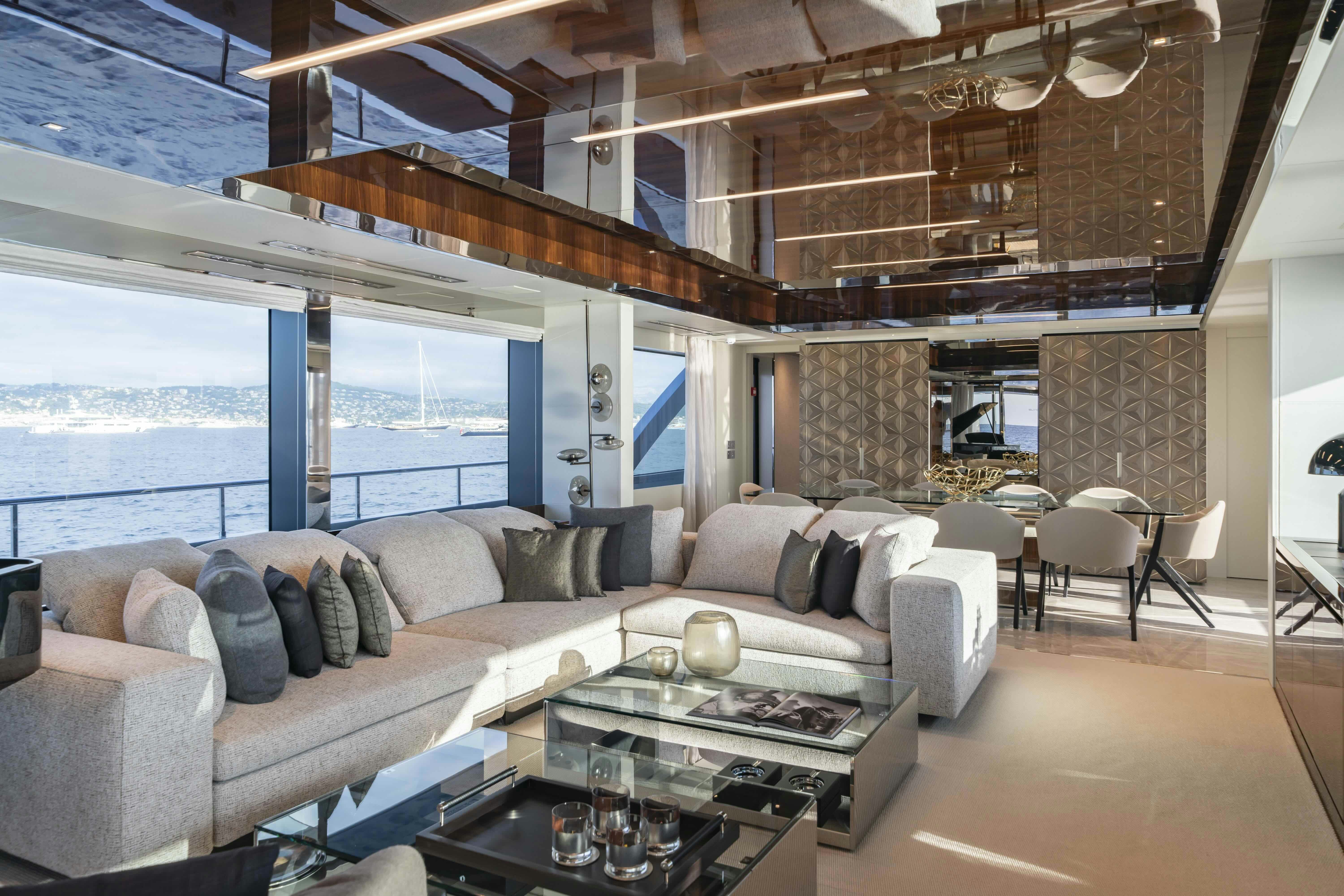 a living room with a large window aboard ELYSIUM I Yacht for Sale