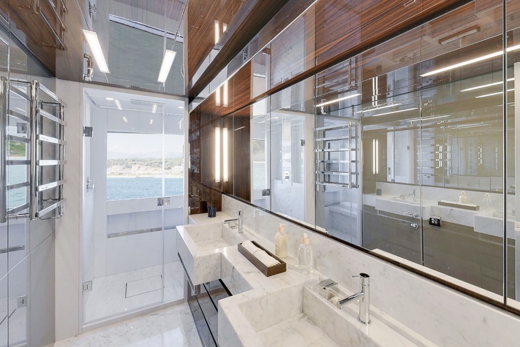 a bathroom with a large mirror aboard ELYSIUM I Yacht for Sale