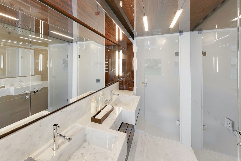 a bathroom with a large mirror aboard ELYSIUM I Yacht for Sale