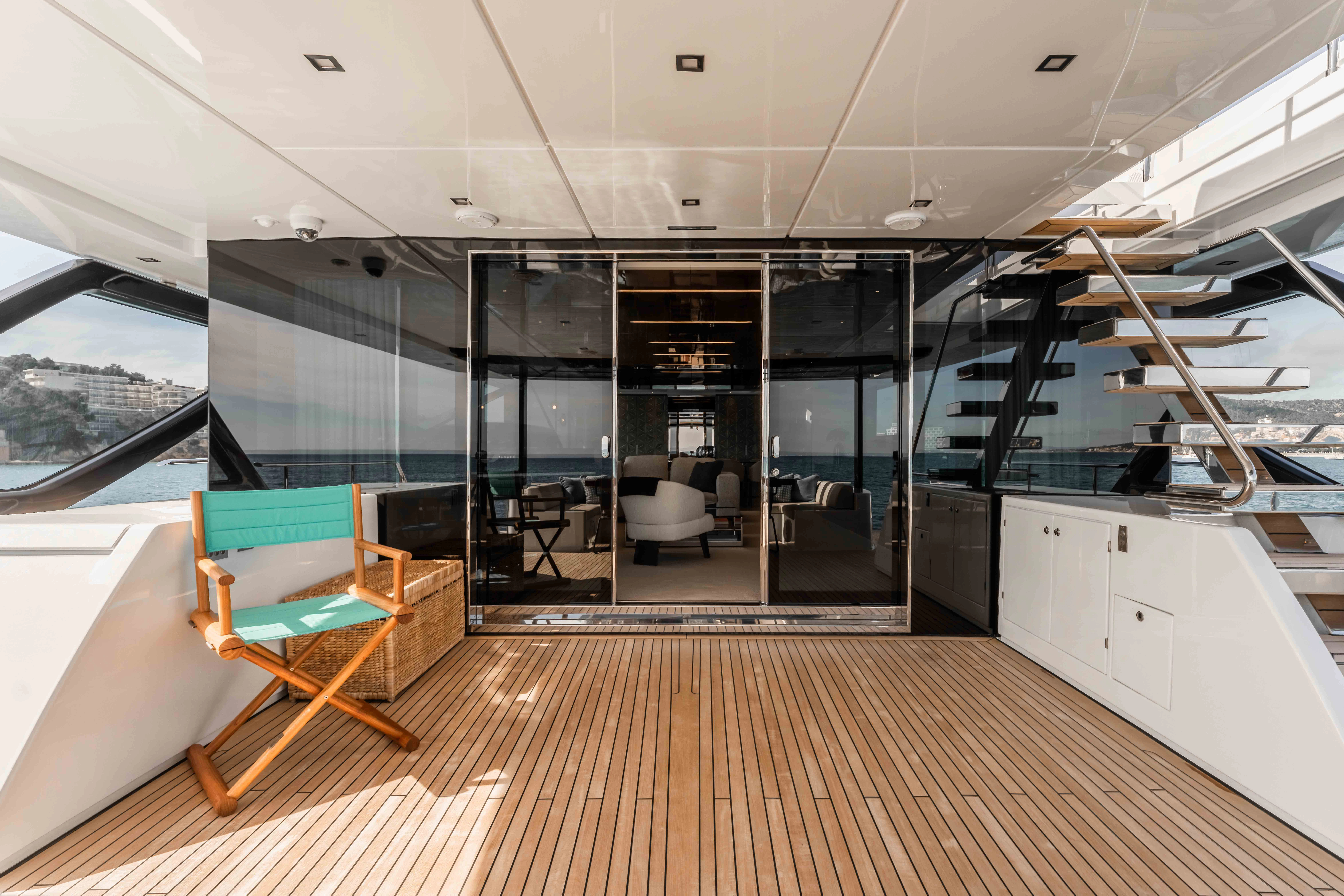 a room with a wood floor and chairs and a wood floor aboard ELYSIUM I Yacht for Sale