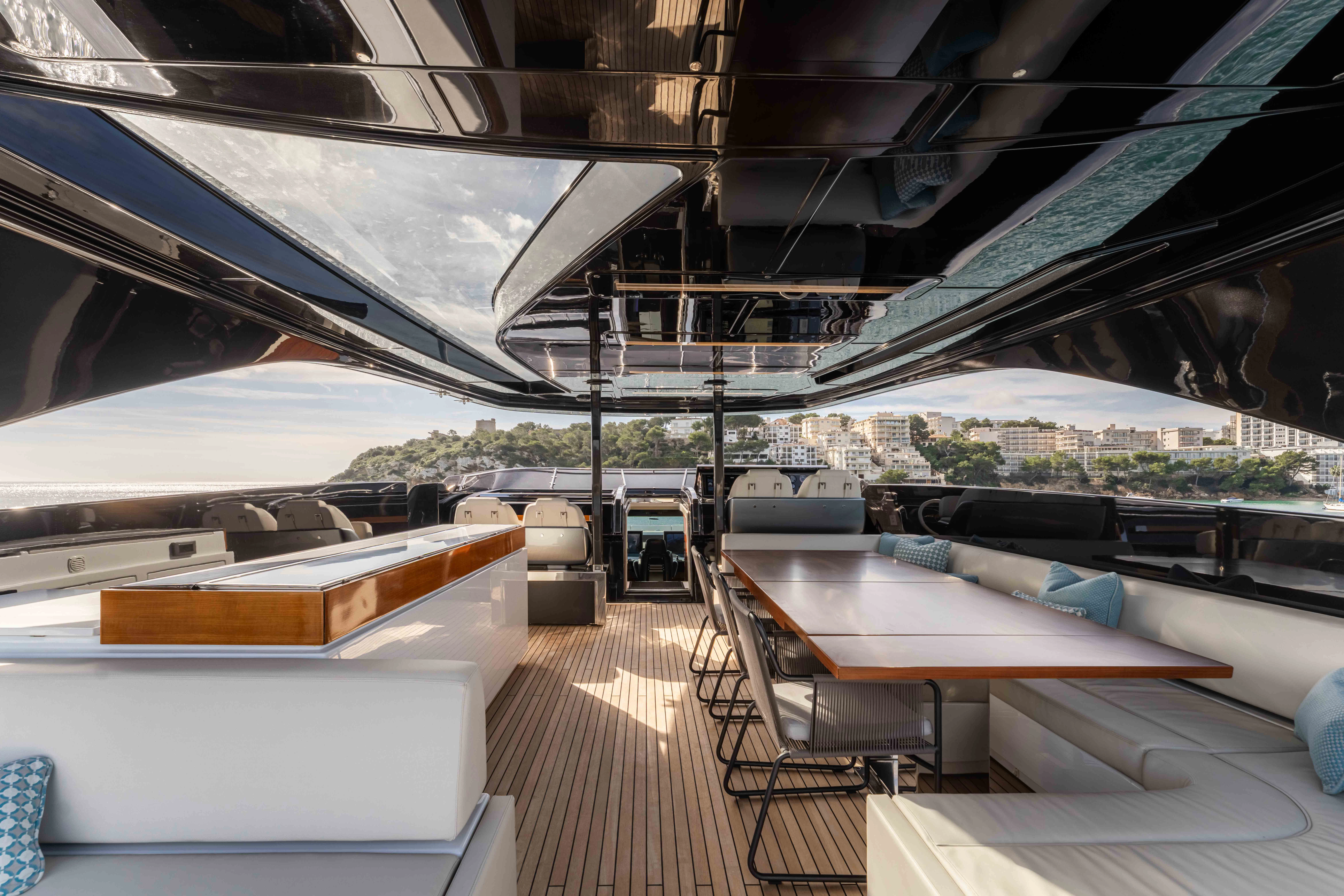 a deck with tables and chairs aboard ELYSIUM I Yacht for Sale