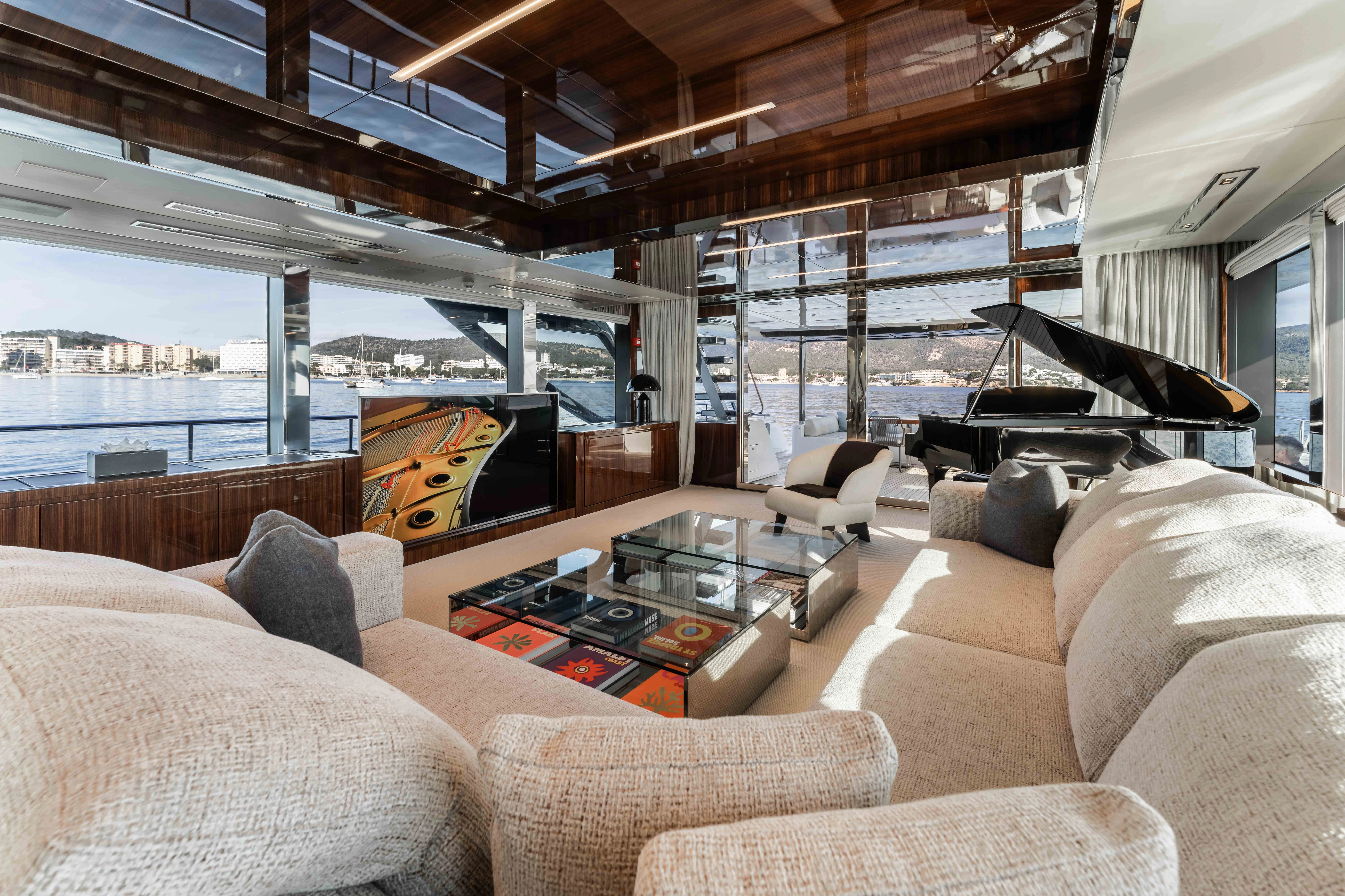 a living room with a large window aboard ELYSIUM I Yacht for Sale