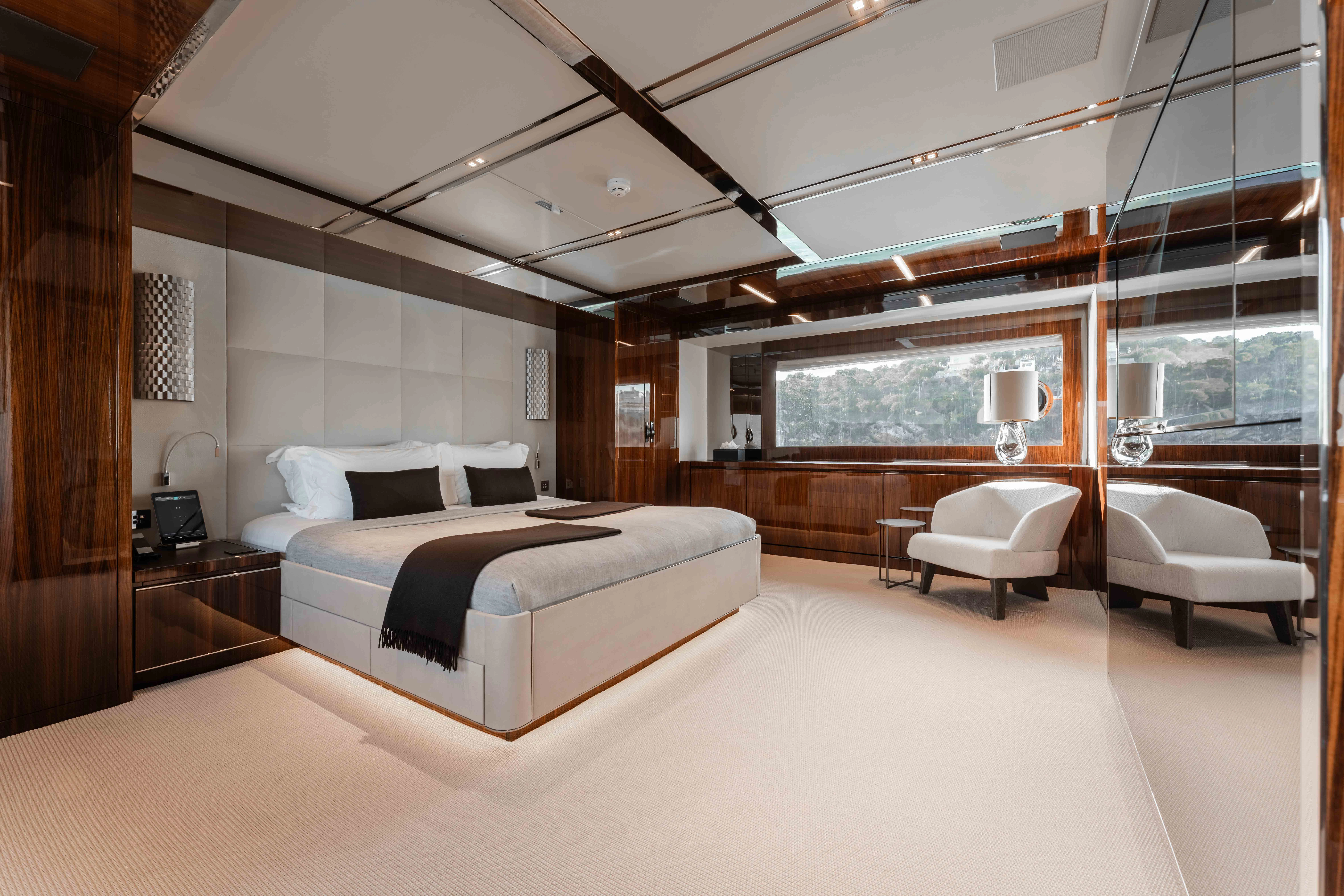 a large bedroom with a large bed aboard ELYSIUM I Yacht for Sale
