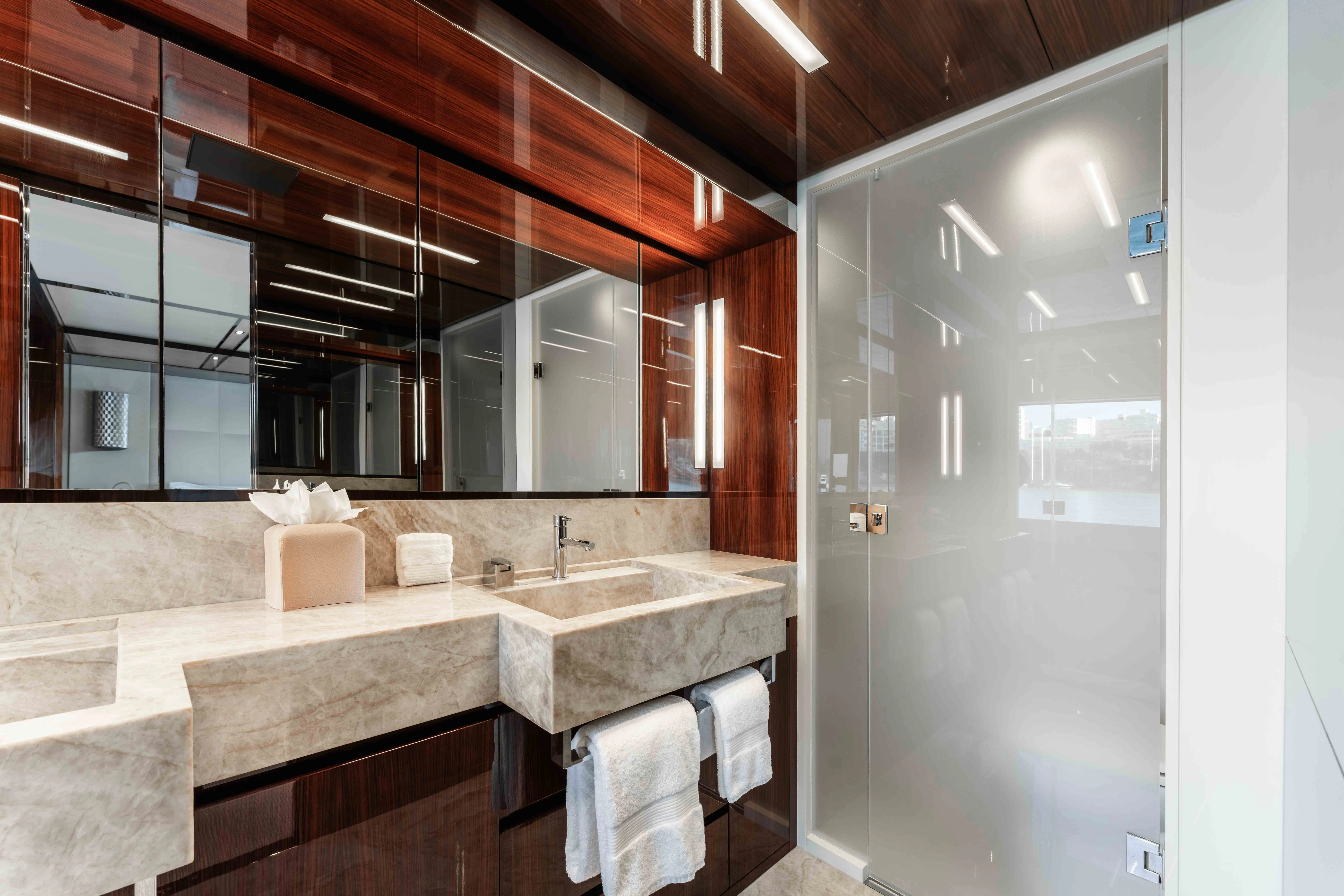 a bathroom with a sink and a mirror aboard ELYSIUM I Yacht for Sale