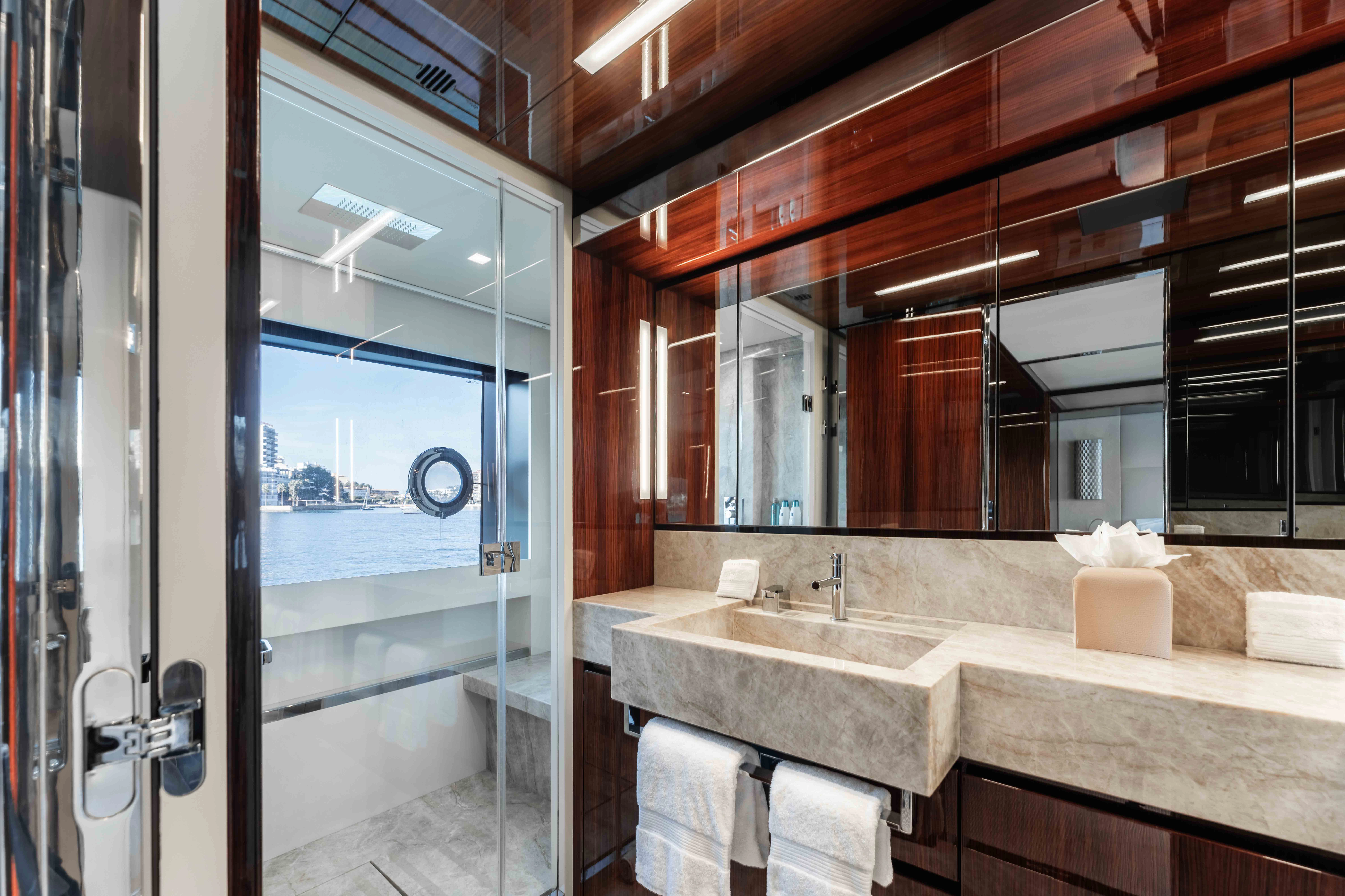 a bathroom with a large mirror aboard ELYSIUM I Yacht for Sale