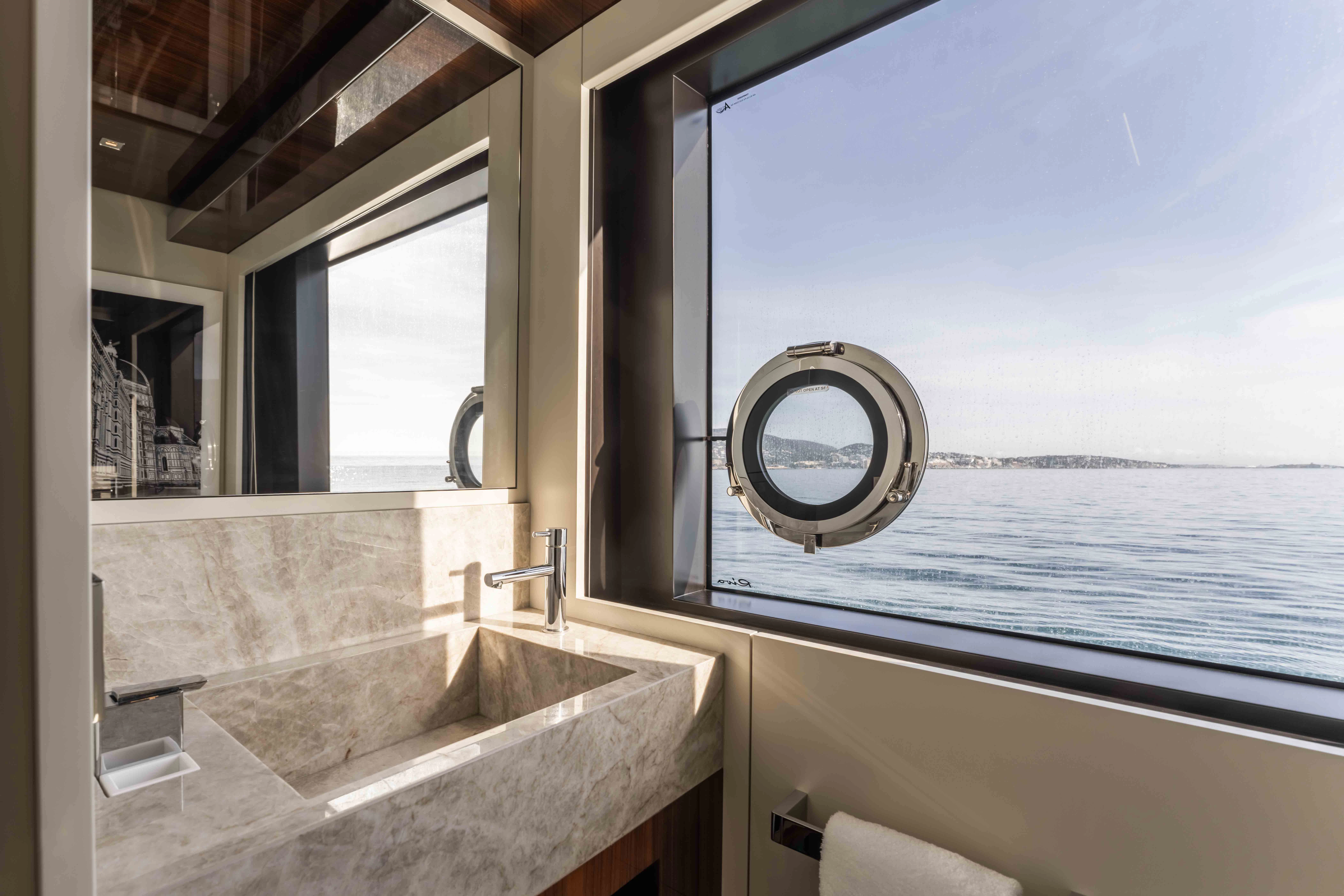 a bathroom with a large tub aboard ELYSIUM I Yacht for Sale