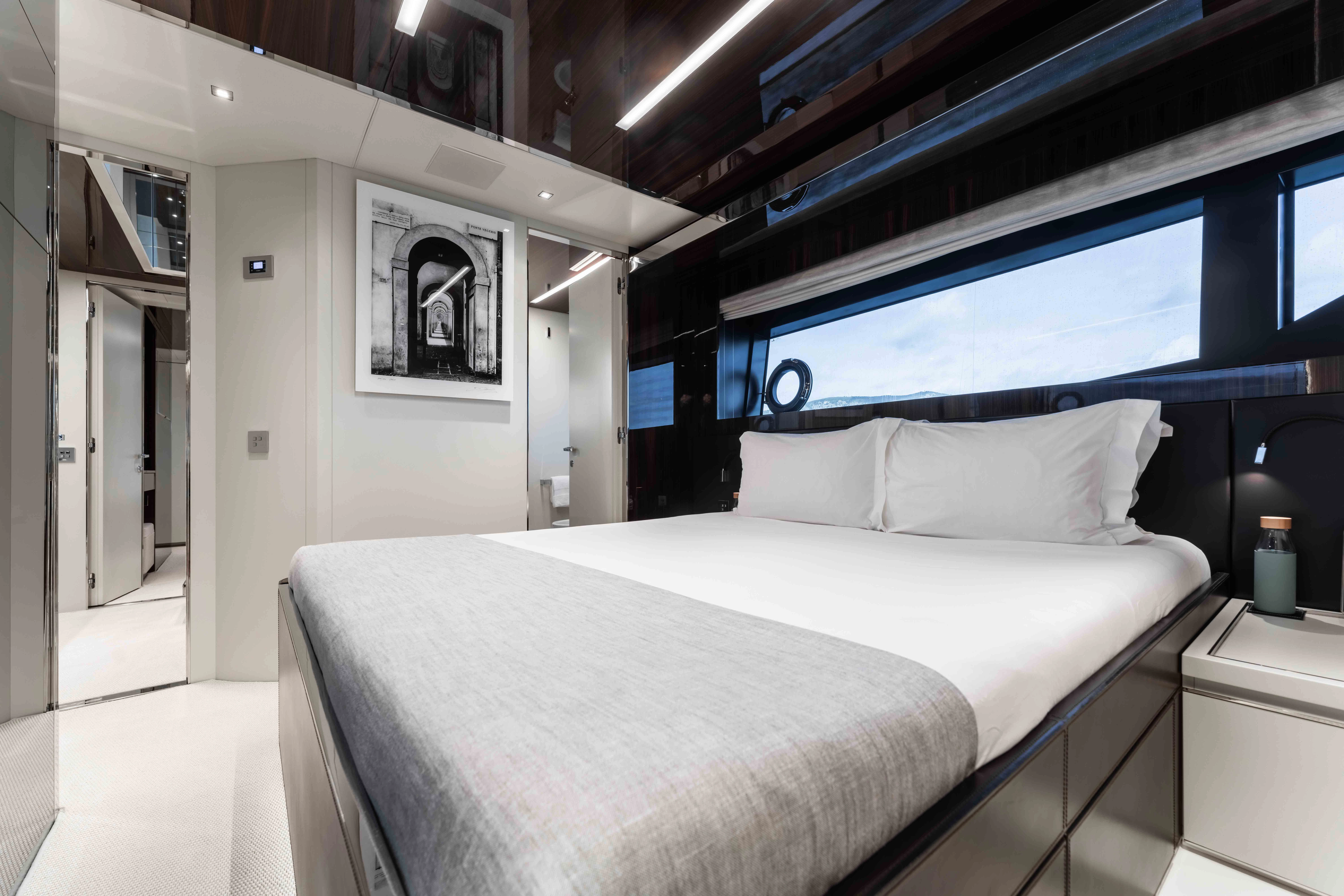 a bed in a room aboard ELYSIUM I Yacht for Sale