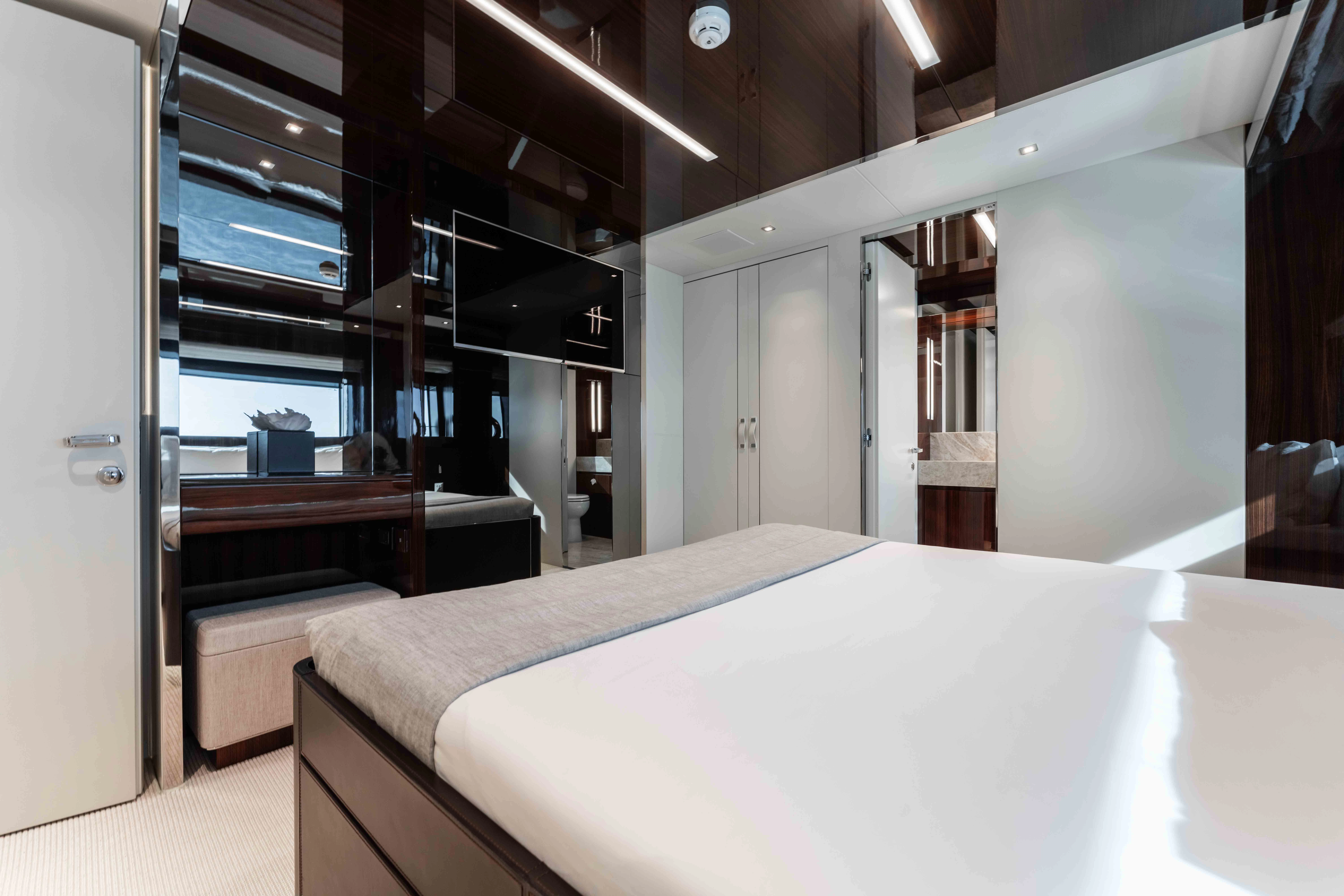 a room with a bed and a piano aboard ELYSIUM I Yacht for Sale