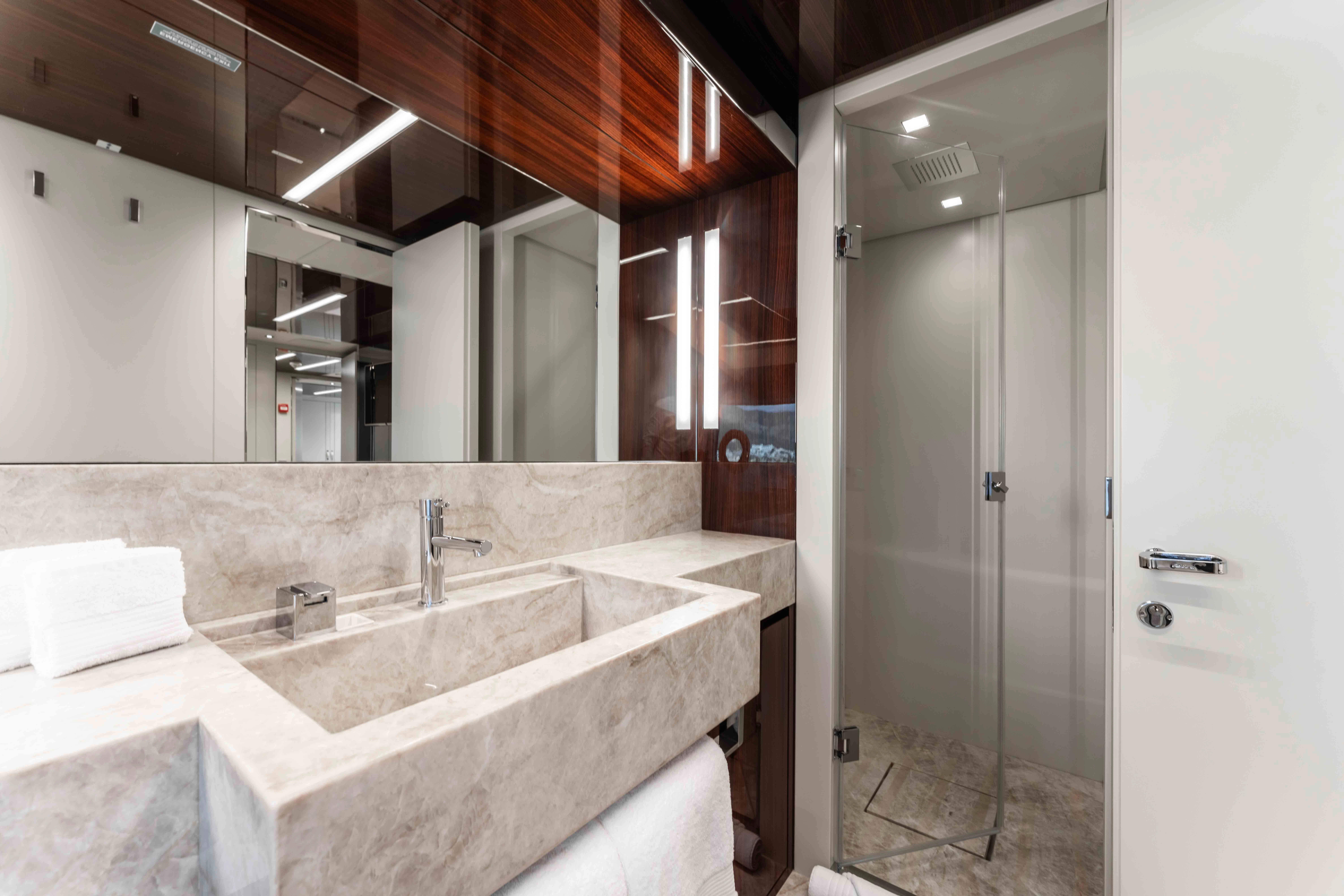 a bathroom with a sink and a shower aboard ELYSIUM I Yacht for Sale