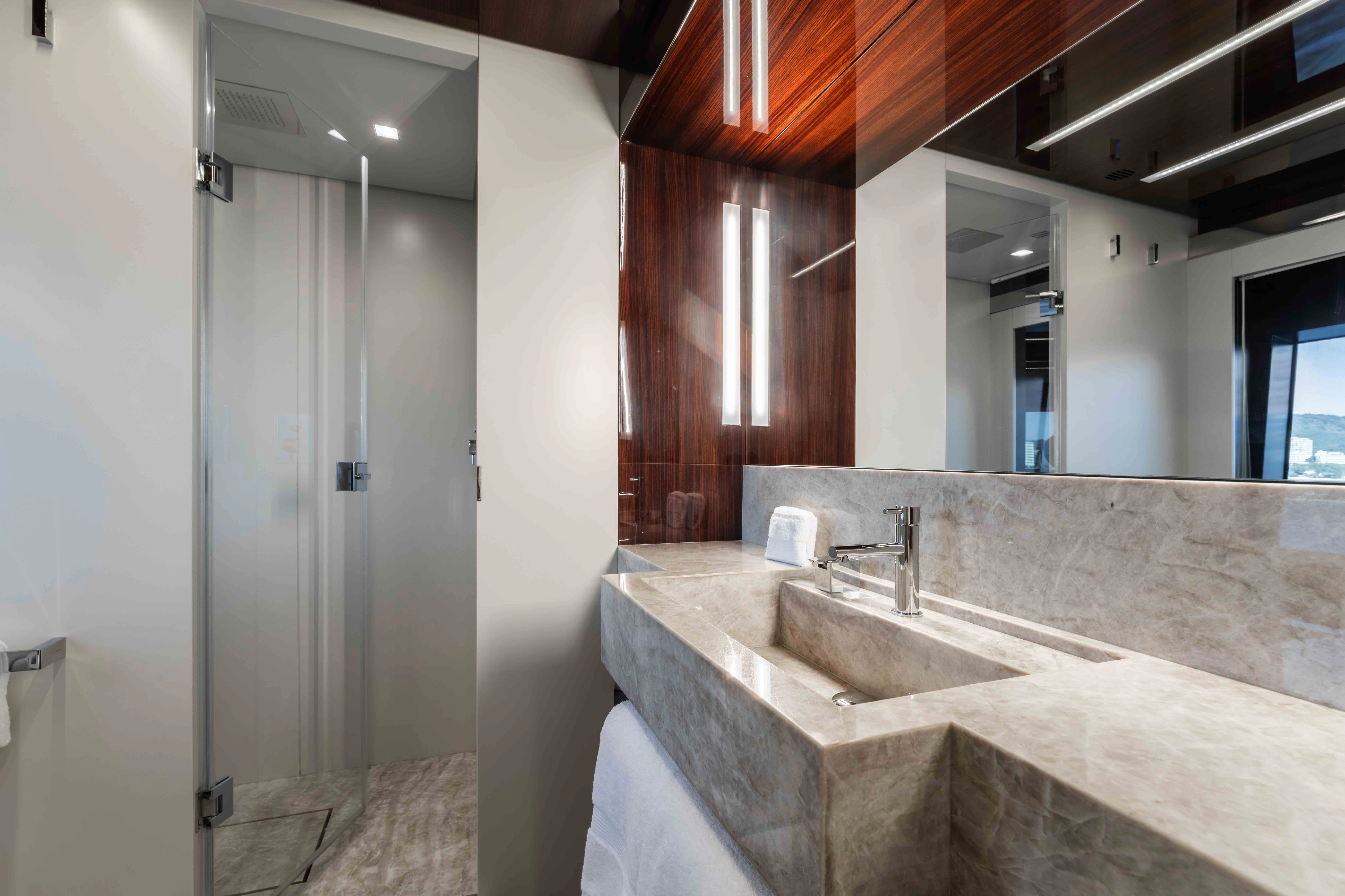 a bathroom with a countertop sink and a mirror aboard ELYSIUM I Yacht for Sale