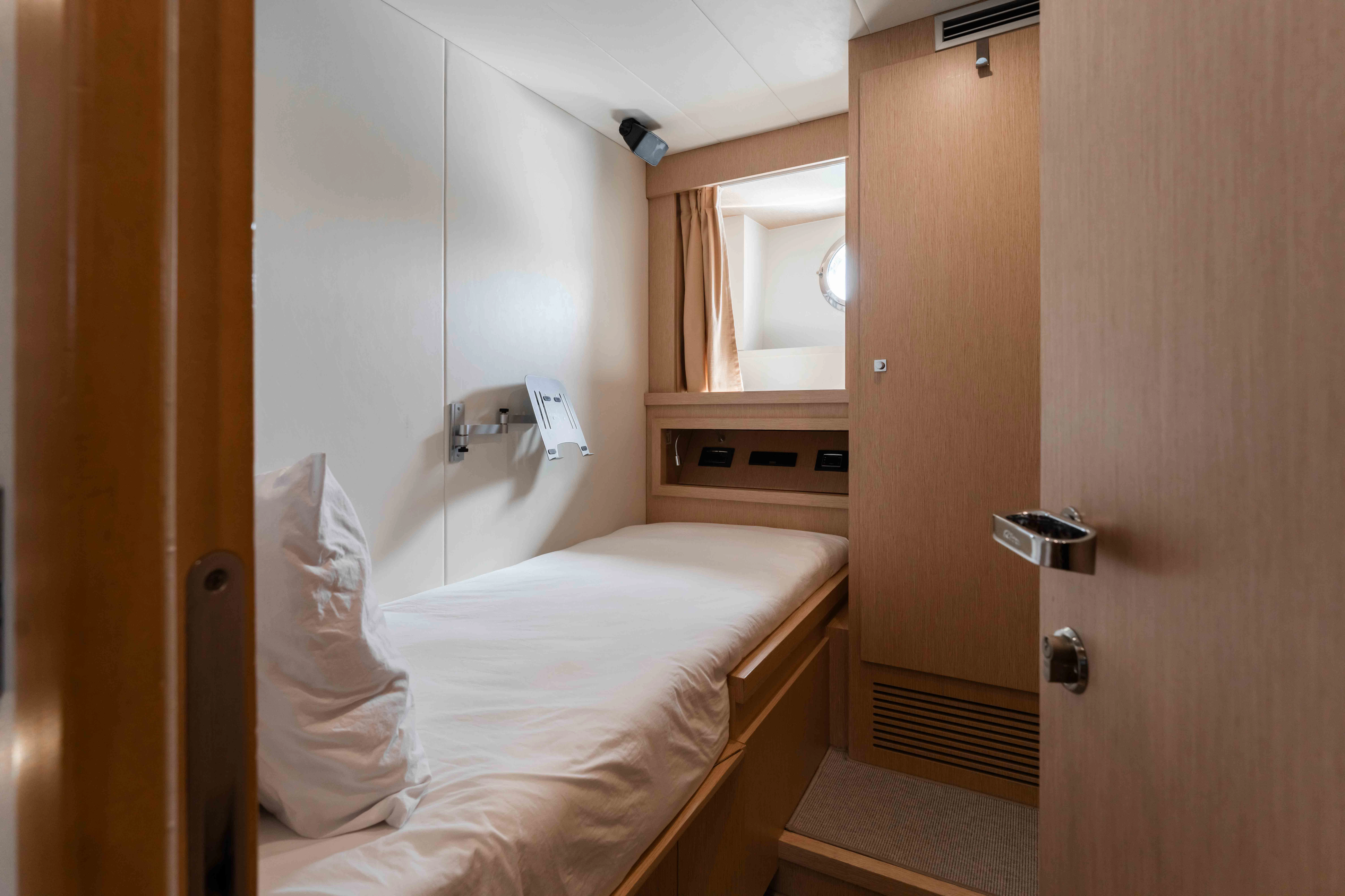 a bed in a room aboard ELYSIUM I Yacht for Sale