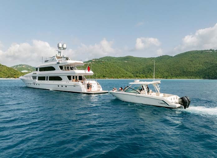 a couple of white boats on water aboard JUST ENOUGH Yacht for Charter