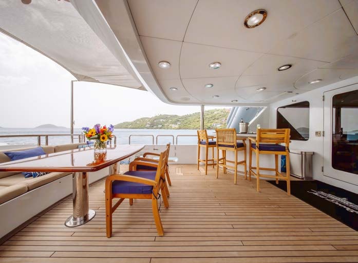 a room with a table and chairs aboard JUST ENOUGH Yacht for Charter