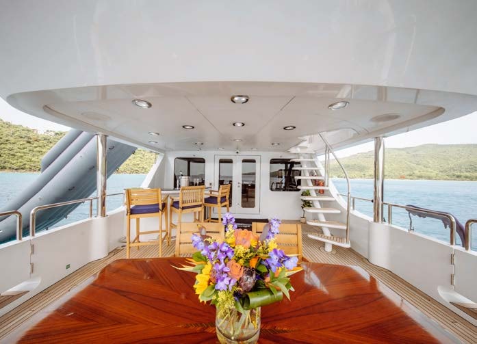 a large white boat with flowers in it aboard JUST ENOUGH Yacht for Charter