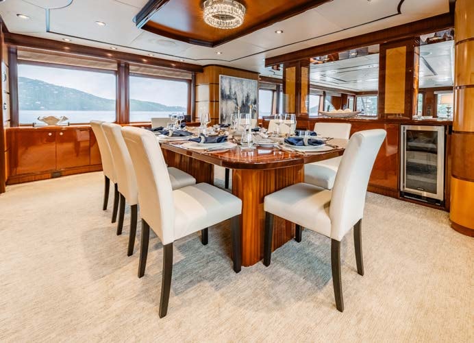 a table and chairs in a room aboard JUST ENOUGH Yacht for Charter