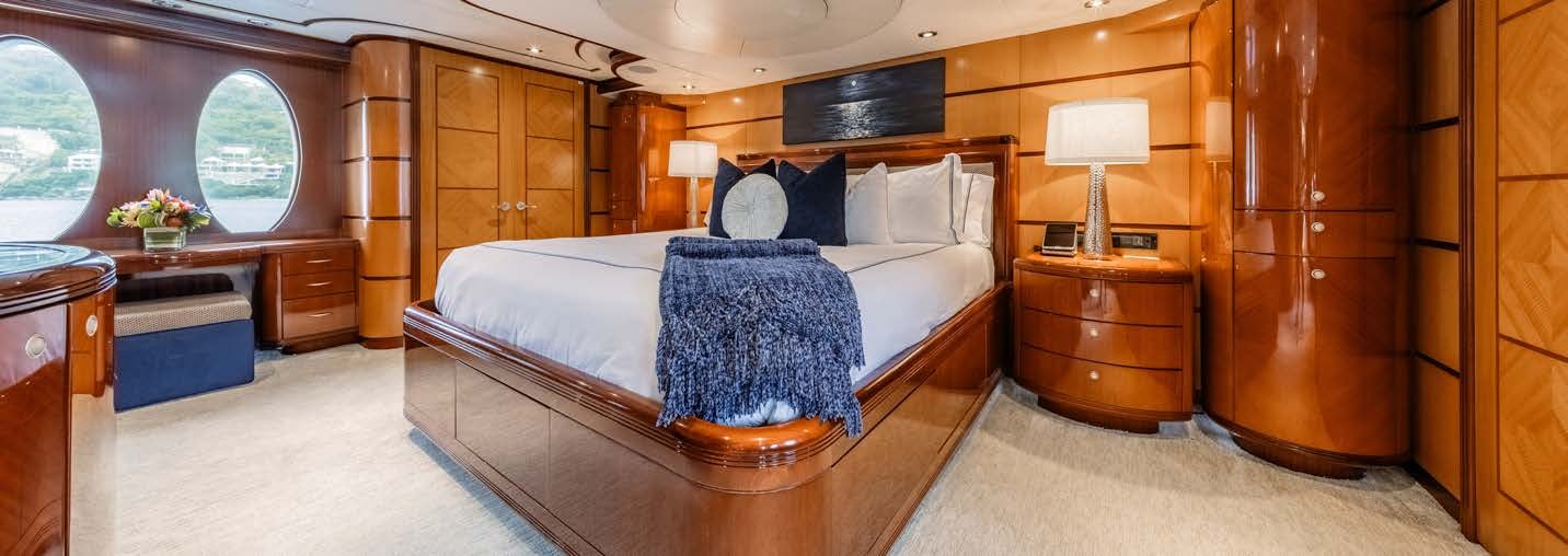 a large bedroom with a large bed aboard JUST ENOUGH Yacht for Charter