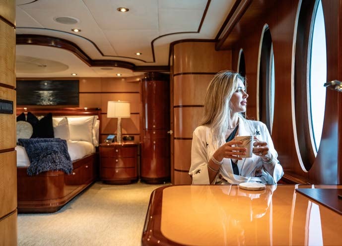 a person sitting at a table aboard JUST ENOUGH Yacht for Charter