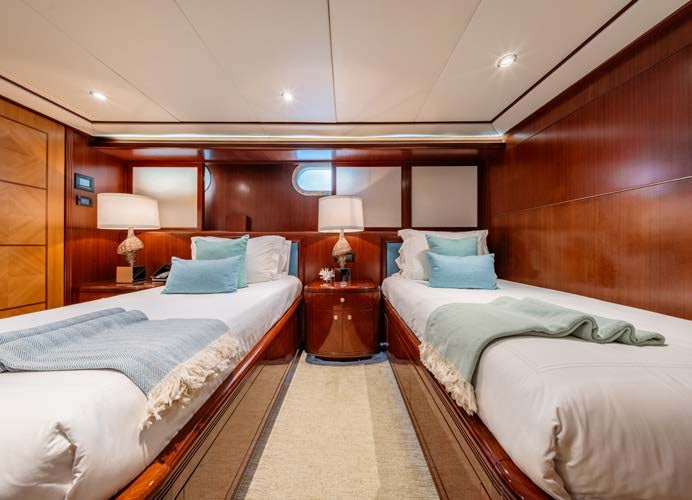 a couple of beds in a hotel room aboard JUST ENOUGH Yacht for Charter