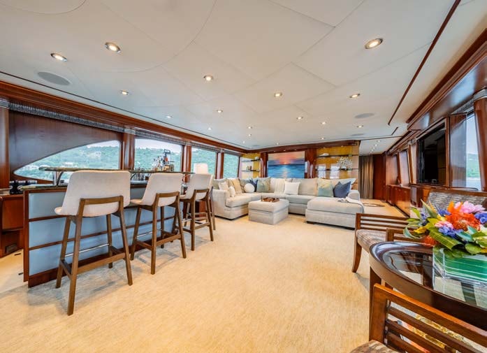 a large living room with a large window aboard JUST ENOUGH Yacht for Charter