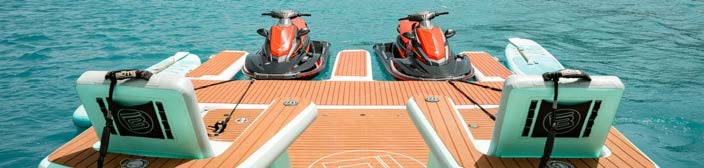 a boat with a motor attached to it aboard JUST ENOUGH Yacht for Charter