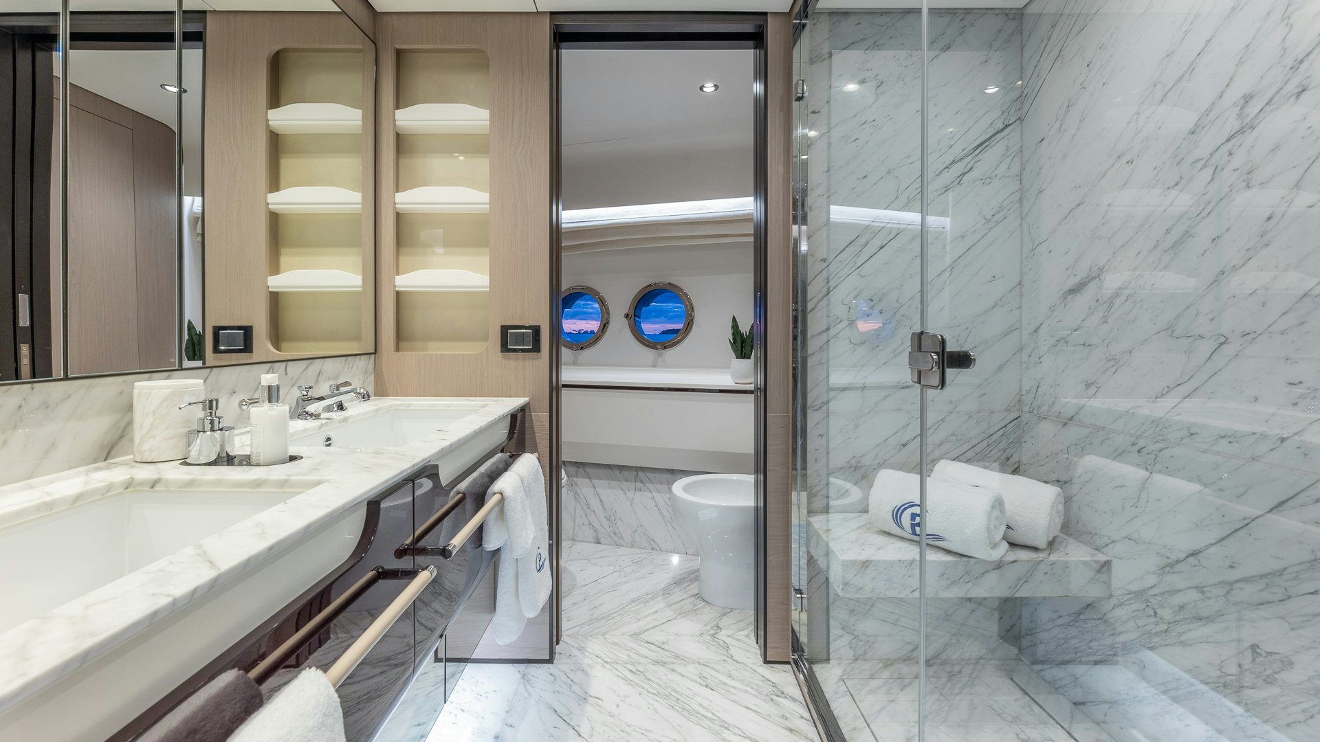 a bathroom with a glass shower aboard PIER PRESSURE Yacht for Charter