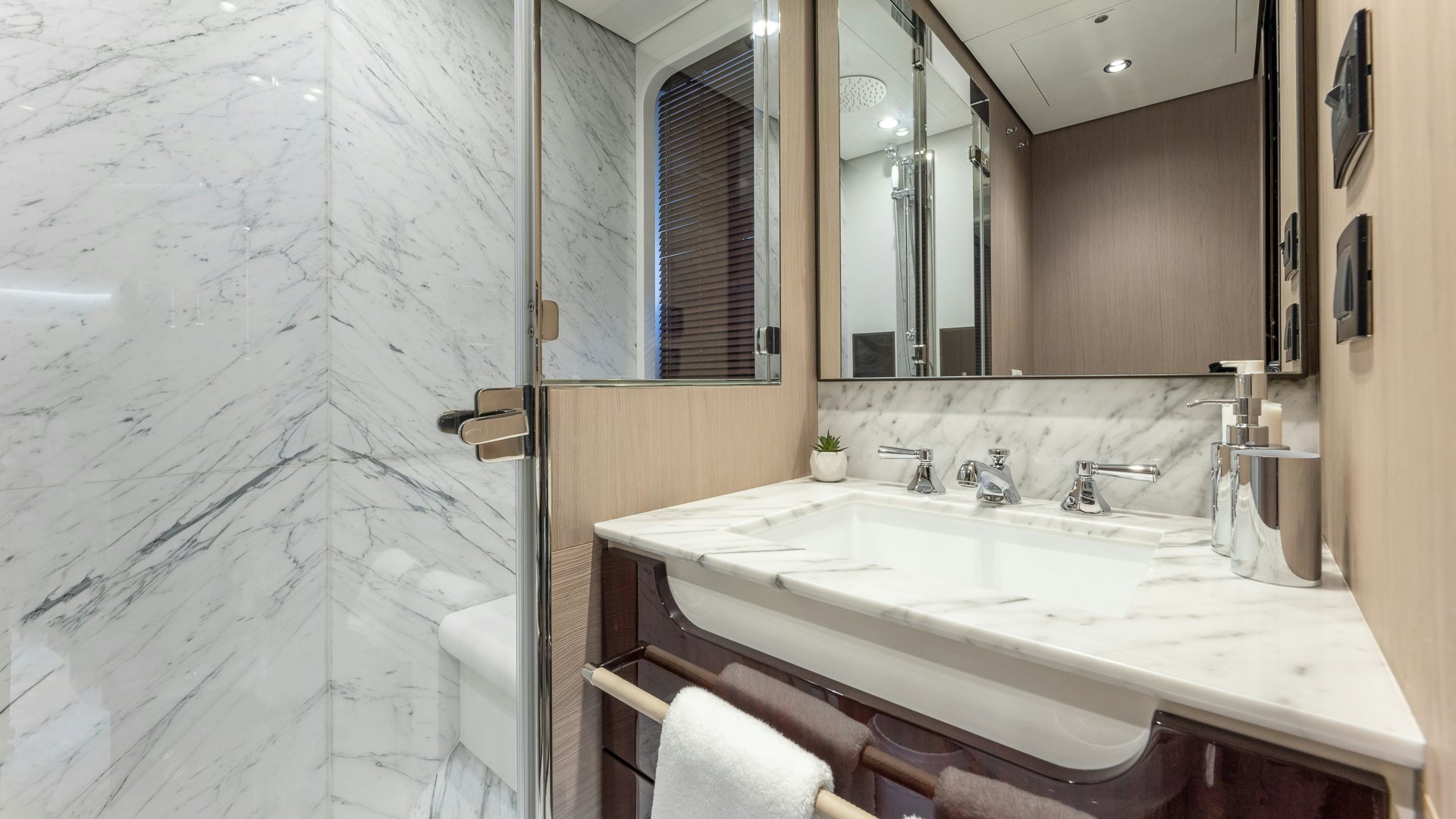 a bathroom with a large mirror aboard PIER PRESSURE Yacht for Charter