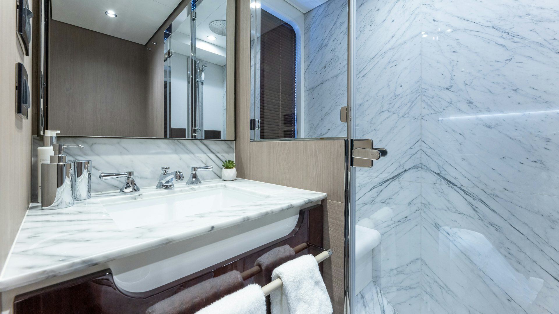 a bathroom with a sink and a mirror aboard PIER PRESSURE Yacht for Charter