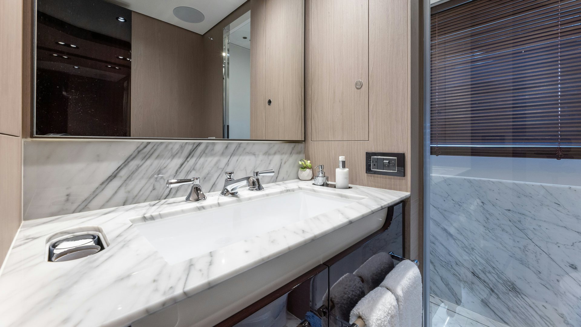 a bathroom with a large mirror aboard PIER PRESSURE Yacht for Charter